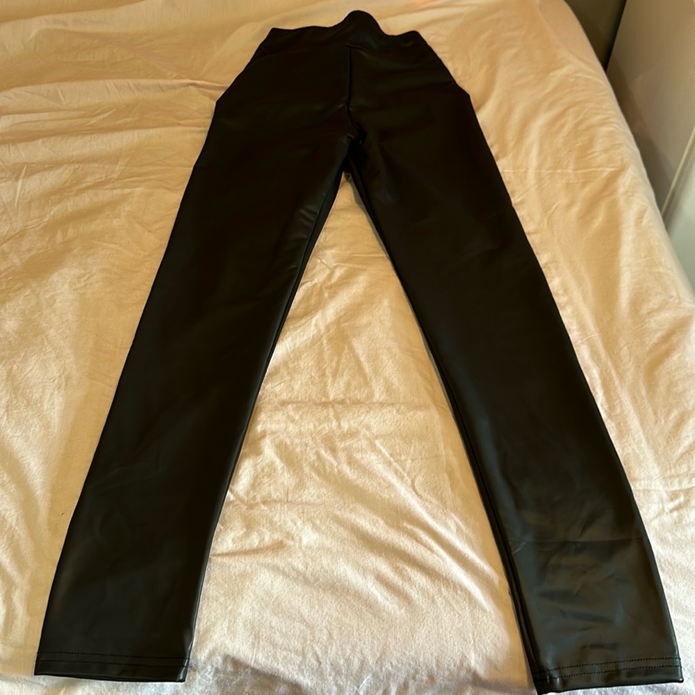 Faux leather pants with plenty stretch. Black size Medium.
